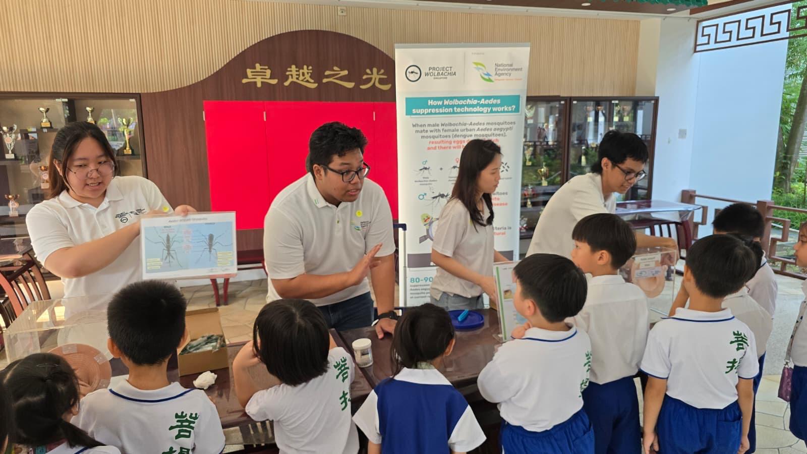Project Wolbachia - Pupils listening attentively to NEA officers explaining more on mosquito