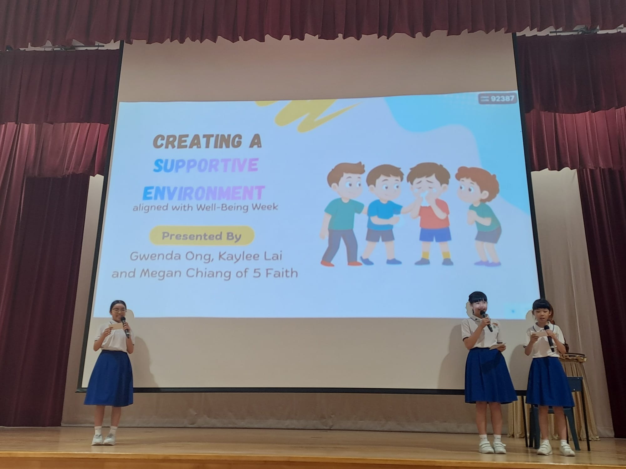 Children on stage explaining on creating and supportive environment
