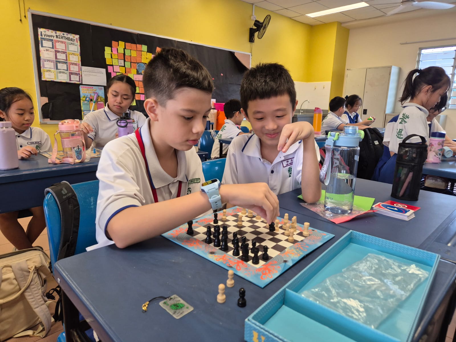 Pupils in school attire bonding through games during Back to School Programme
