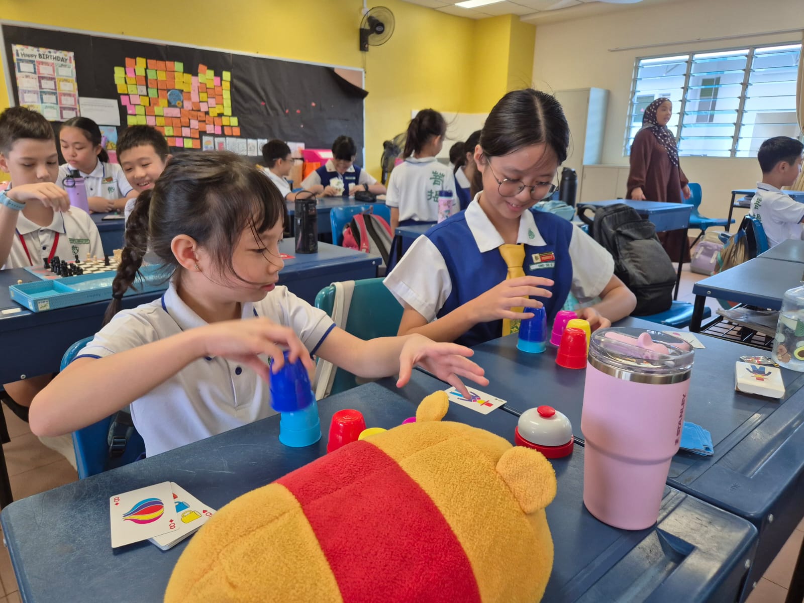 Pupils in school attire bonding through games during Back to School Programme