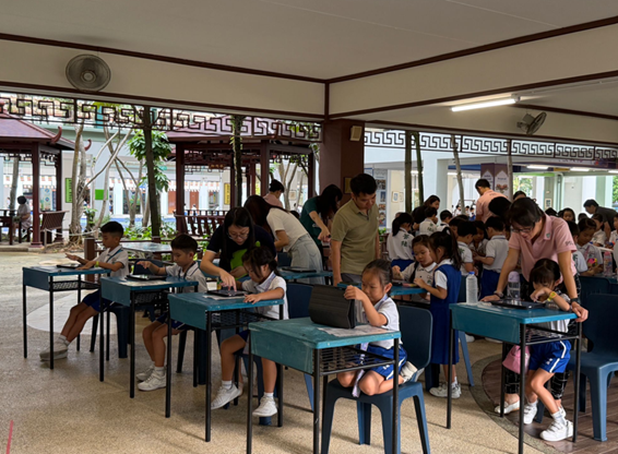 Pupils gathered in courtyard learning mathematics the fun way - games