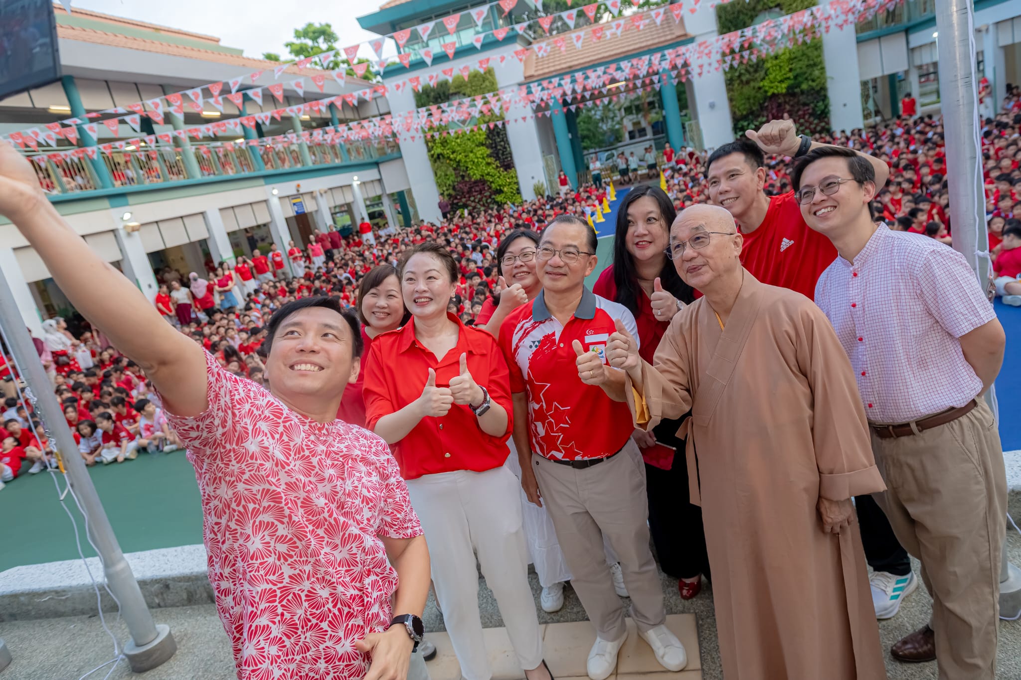 Guest of honour taking wefie during National Day Celebration.