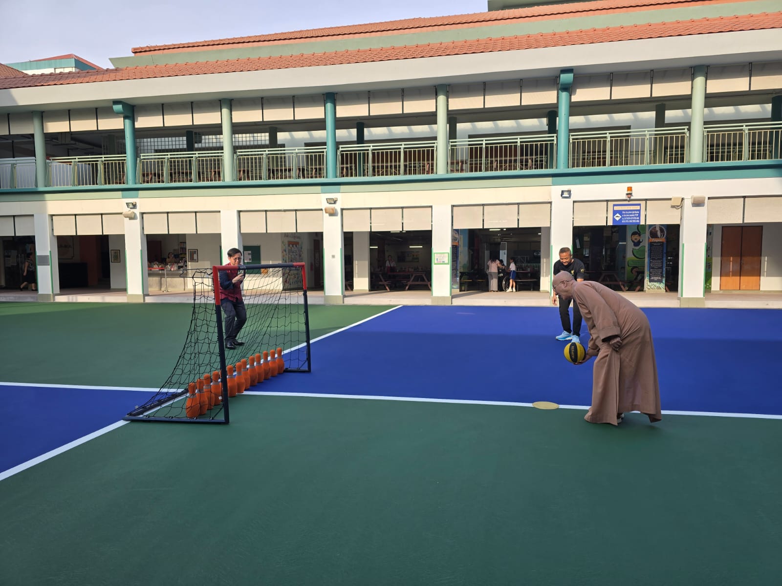 Venerable Seck Kwang Phing officiating the opening of Maha Bodhi School’s revamped Parade Square.