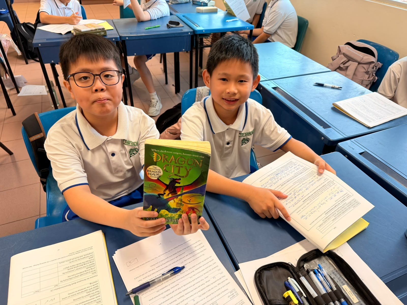 Pupils in class holding on to their reading record and their favourite storybook.